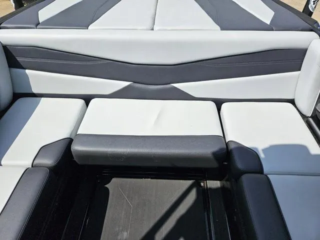Slide: The Image of 2024 Axis Wake Research A225 boat interior with sleek, modern seating design. - 25