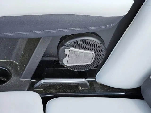 Slide: The Image of 2024 Axis Wake Research A225 interior speaker detail with gray upholstery. - 28