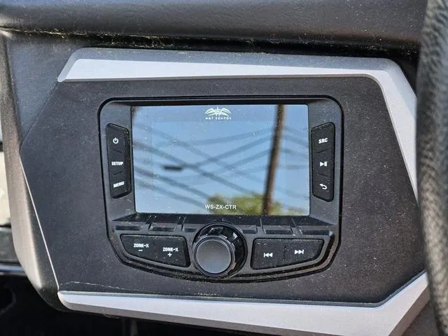 Slide: The Image of 2024 Axis Wake Research A225 dashboard with control panel and display screen. - 30