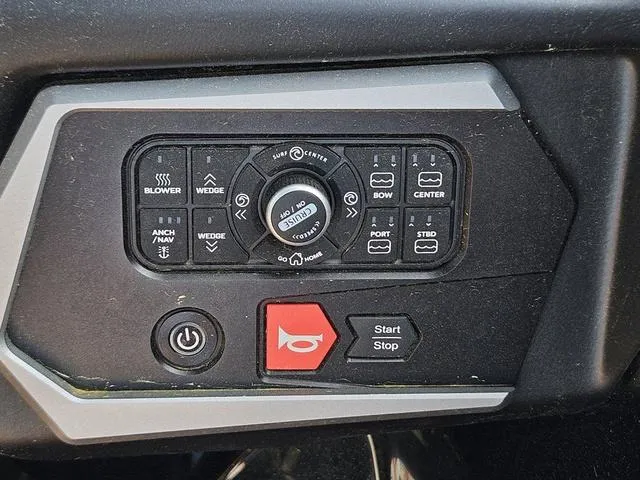 Slide: The Image of Control panel of a 2024 Axis Wake Research A225 boat with various function buttons. - 32