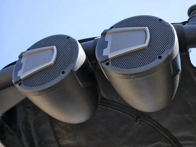 Slide: The Image of 2024 Axis Wake Research A225 boat speakers mounted on a wakeboard tower. - 38