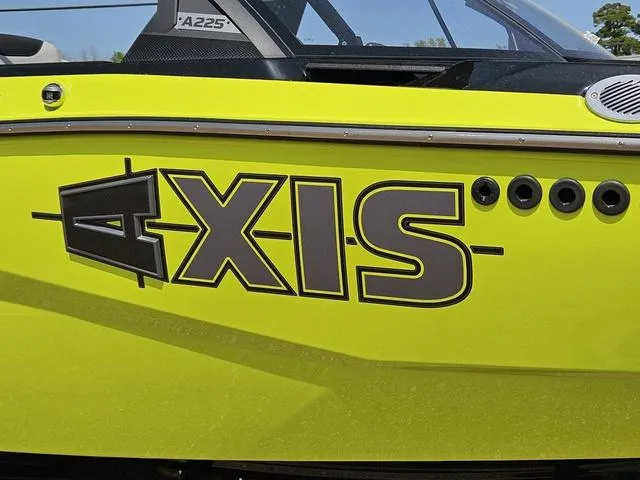 Slide: The Image of 2024 Axis Wake Research A225 boat, vibrant yellow exterior with bold "AXIS" logo. - 8