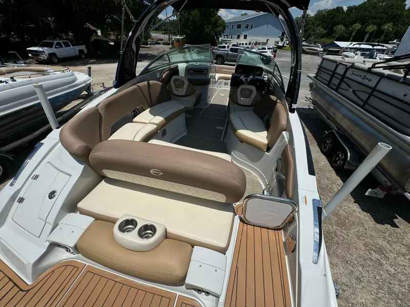Slide: The Image of 2021 Crownline E275 XS boat with spacious seating and modern design. - 12