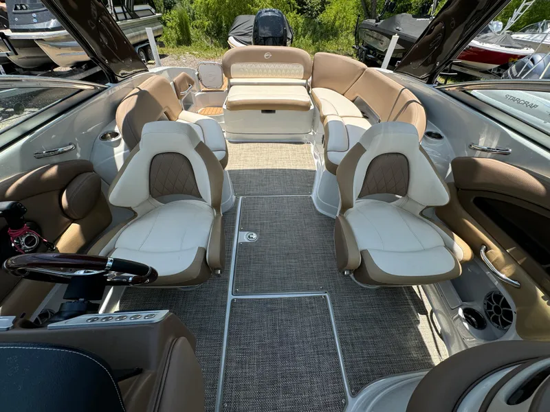 Slide: The Image of 2021 Crownline E275 XS boat interior with luxurious seating and modern design. - 9