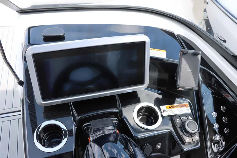 Slide: The Image of 2024 Yamaha Boats 252SD dashboard with touchscreen display and control panel. - 11