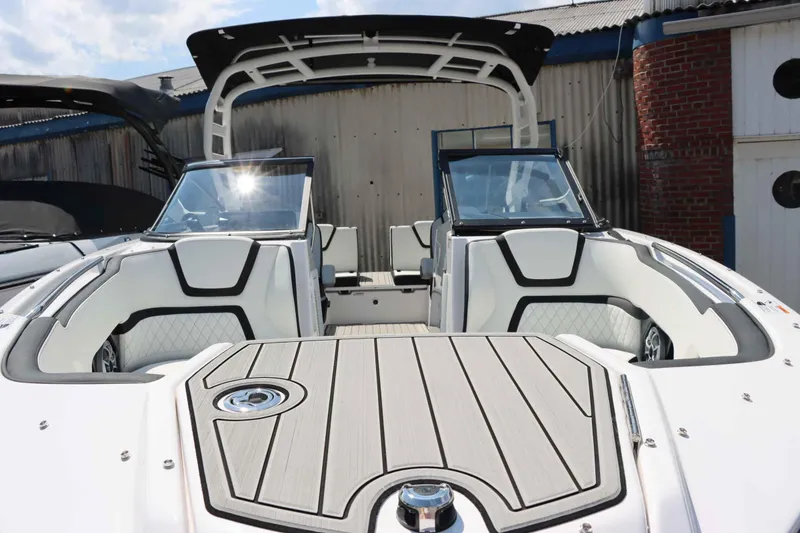 Slide: The Image of 2024 Yamaha Boats 252SD interior, featuring sleek white and black seating with modern design elements. - 4