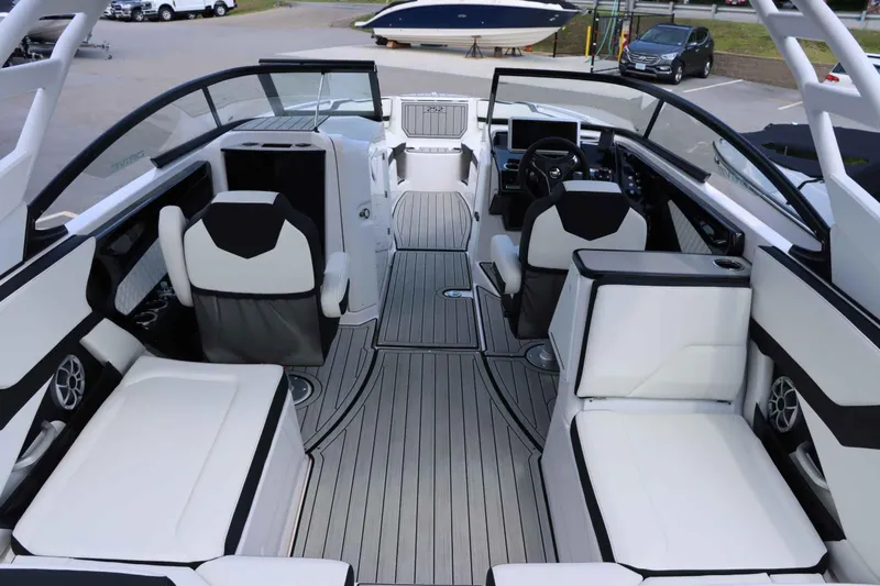 Slide: The Image of Interior of 2024 Yamaha Boats 252SD, featuring sleek seating and modern dashboard. - 7