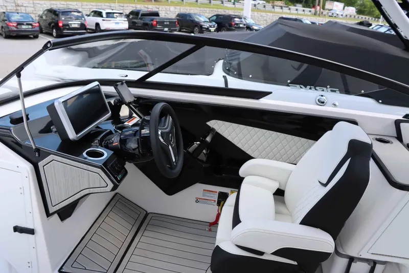 Slide: The Image of Interior cockpit of 2024 Yamaha Boats 252SD, featuring modern dashboard and luxurious seating. - 9