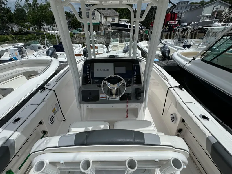 Slide: The Image of 2023 Robalo R230 Center Console boat with Garmin navigation system. - 3