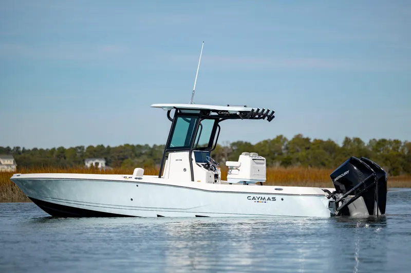 Slide: The Image of 2024 Caymas 281 HB boat on calm water. - 2