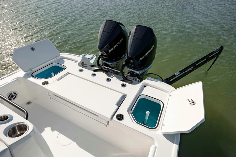 Slide: The Image of 2024 Caymas 281 HB boat with dual Mercury engines on water. - 28