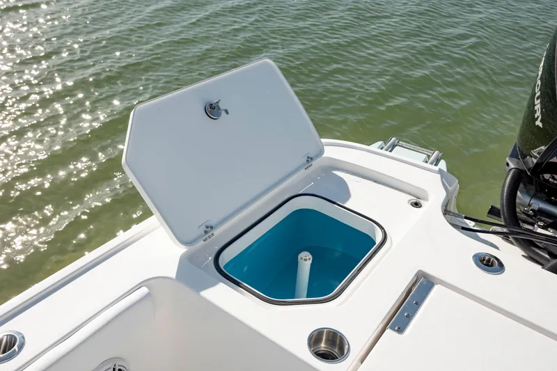 Slide: The Image of 2024 Caymas 281 HB boat with open storage compartment on deck. - 29