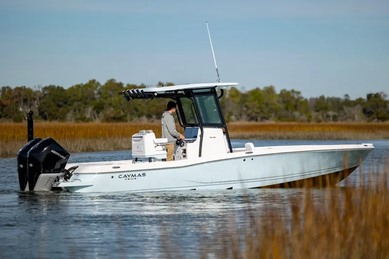 Slide: The Image of 2024 Caymas 281 HB boat cruising on a calm lake. - 3