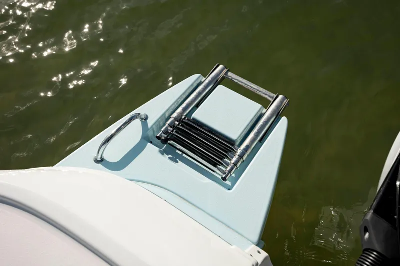 Slide: The Image of 2024 Caymas 281 HB boat with a folded swim ladder on the deck. - 31