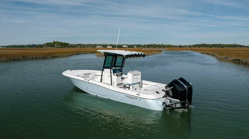 Slide: The Image of 2024 Caymas 281 HB boat in a serene waterway. - 38