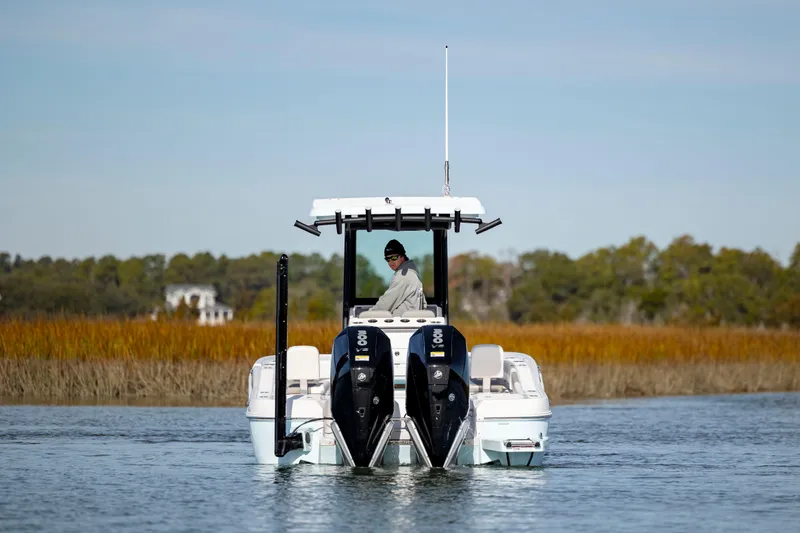 Slide: The Image of 2024 Caymas 281 HB boat on water with dual engines. - 7