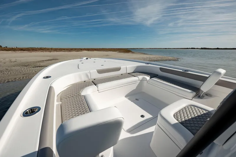 Slide: The Image of 2024 Caymas 281 HB boat interior with luxurious seating and scenic water view. - 9