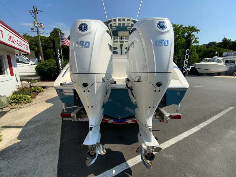 Slide: The Image of 2025 Cobia 265 CC boat with twin Yamaha 150 outboard engines. - 10