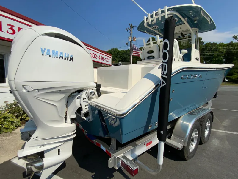 Slide: The Image of 2025 Cobia 265 CC boat with Yamaha engine on trailer. - 11