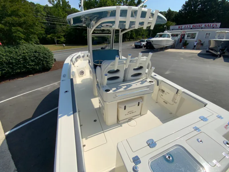 Slide: The Image of 2025 Cobia 265 CC center console boat at a dealership. - 12