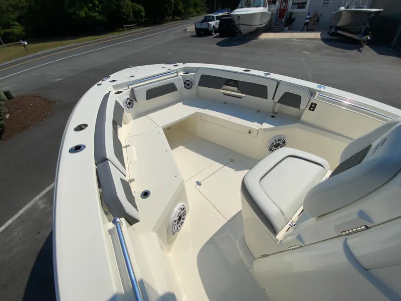Slide: The Image of 2025 Cobia 265 CC boat with spacious seating and modern design. - 32