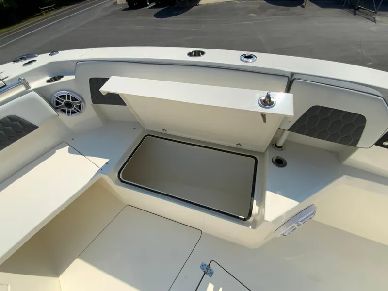 Slide: The Image of Open storage compartment on 2025 Cobia 265 CC boat deck. - 33