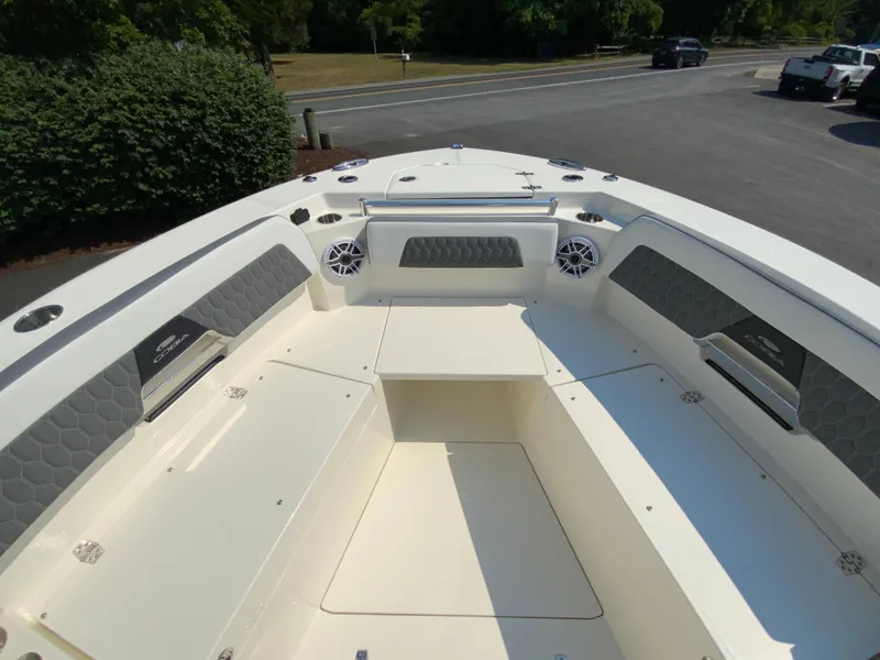 Slide: The Image of 2025 Cobia 265 CC boat interior, spacious seating, modern design. - 34
