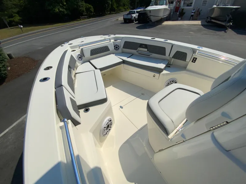 Slide: The Image of 2025 Cobia 265 CC boat with spacious seating and modern design. - 36