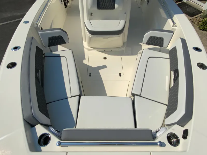 Slide: The Image of 2025 Cobia 265 CC boat interior with cushioned seating and storage compartments. - 39