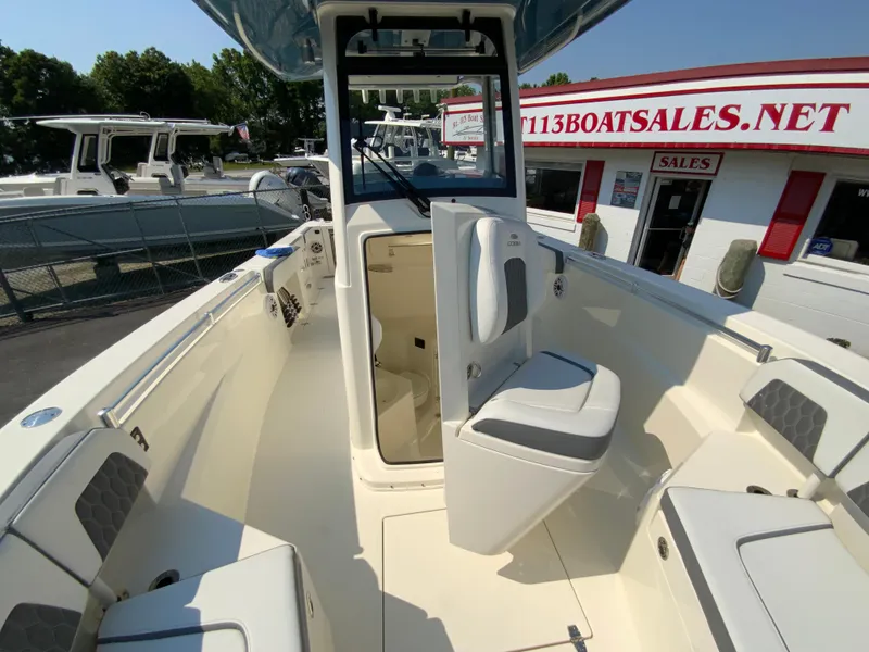 Slide: The Image of 2025 Cobia 265 CC center console boat interior at a boat dealership. - 46