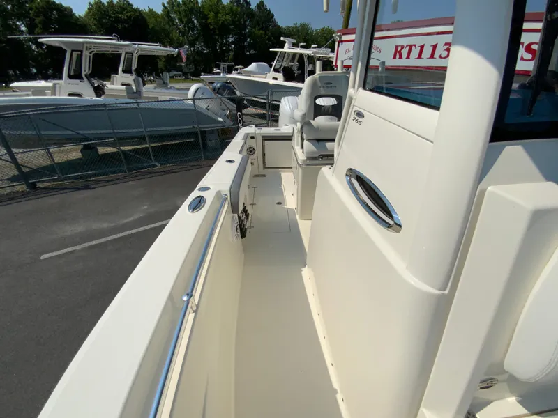 Slide: The Image of 2025 Cobia 265 CC boat deck with seating and storage compartments. - 48