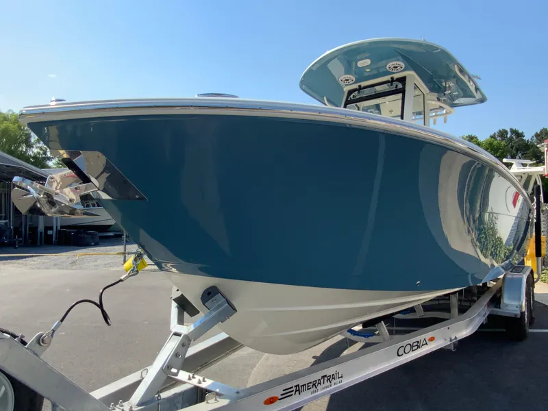 Slide: The Image of 2025 Cobia 265 CC boat on trailer, side view. - 5