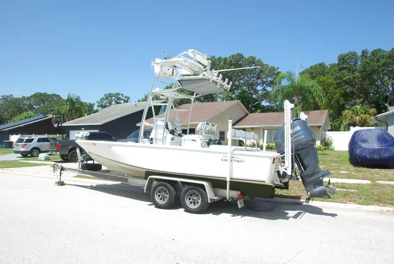 Slide: The Image of 2010 Cape Horn Center Console boat on a trailer in a residential area. - 1