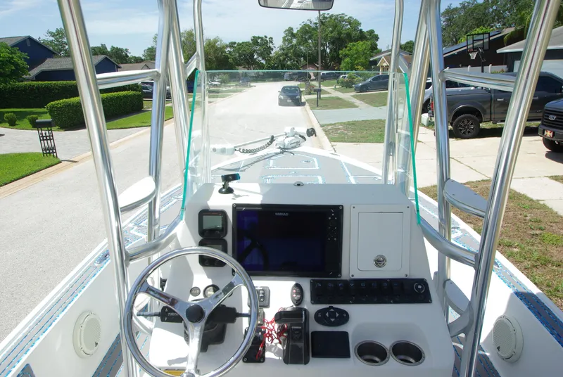Slide: The Image of 2010 Cape Horn Center Console boat dashboard with steering wheel and navigation equipment. - 14