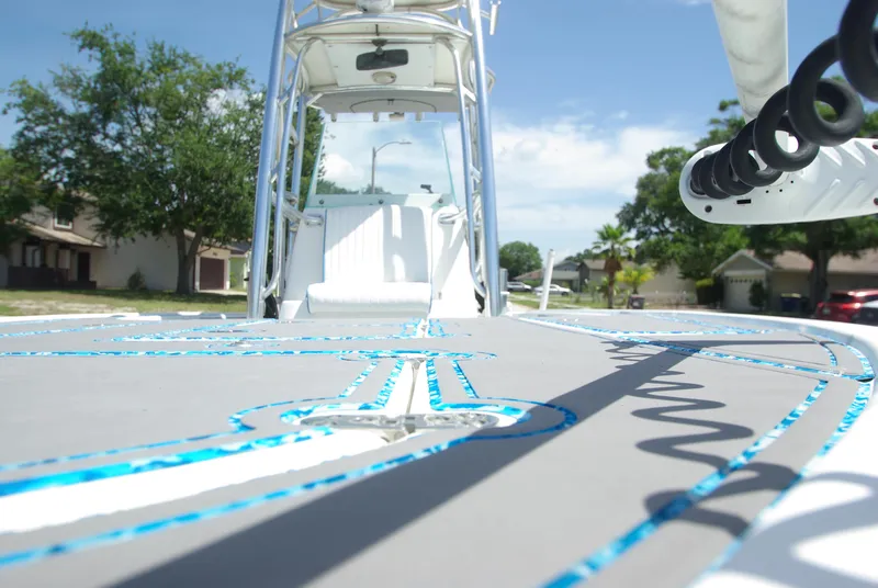 Slide: The Image of 2010 Cape Horn Center Console boat deck with blue accents, sunny day. - 17