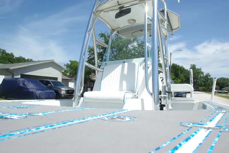 Slide: The Image of 2010 Cape Horn Center Console boat with white seating and blue accents. - 18
