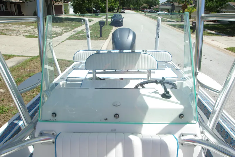 Slide: The Image of 2010 Cape Horn Center Console boat with clear windshield and steering wheel. - 26