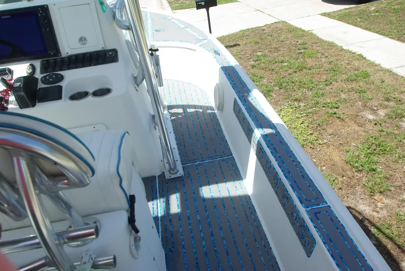 Slide: The Image of 2010 Cape Horn Center Console boat interior with blue and gray deck padding. - 28