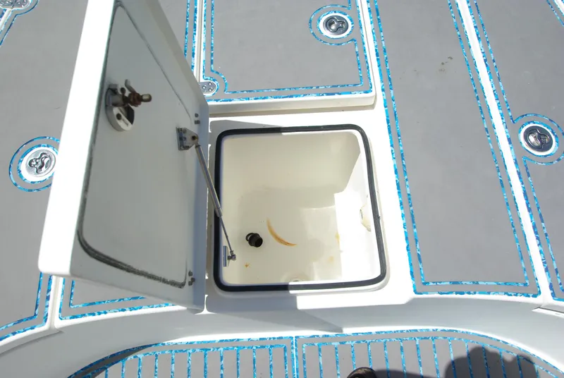 Slide: The Image of 2010 Cape Horn Center Console boat storage compartment with open hatch. - 7