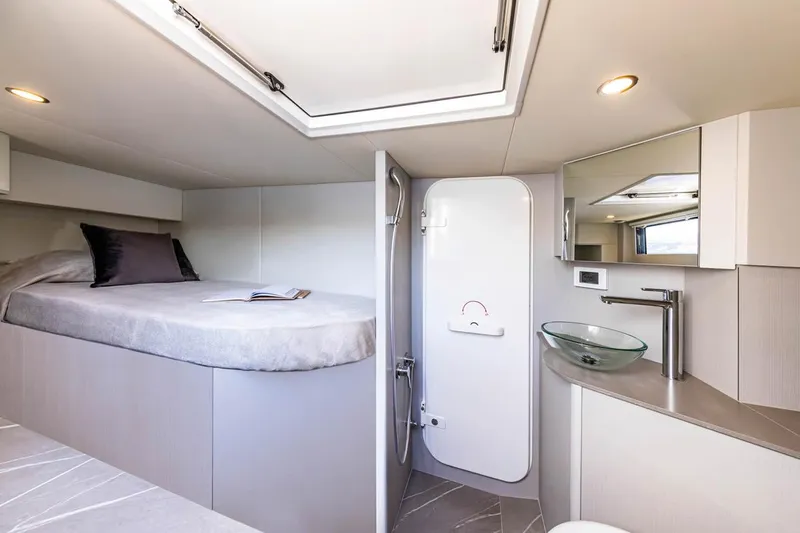 Slide: The Image of Luxurious interior of 2025 Absolute 53 Navetta yacht with modern bedroom and bathroom. - 15