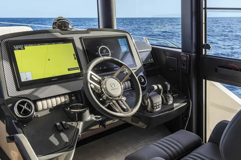 Slide: The Image of Modern helm of 2025 Absolute 53 Navetta yacht with advanced navigation systems. - 8