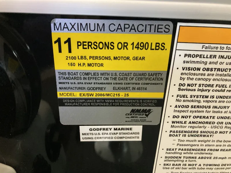 Slide: The Image of Capacity label for 11 persons or 1490 lbs on Godfrey 2086EX Xperience Cruise. - 26