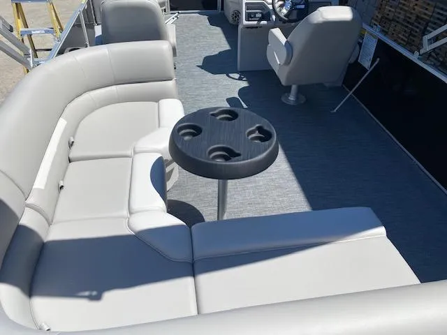 Slide: The Image of Godfrey 2086EX Xperience Cruise 2025 in showroom with water sports gear. - 9