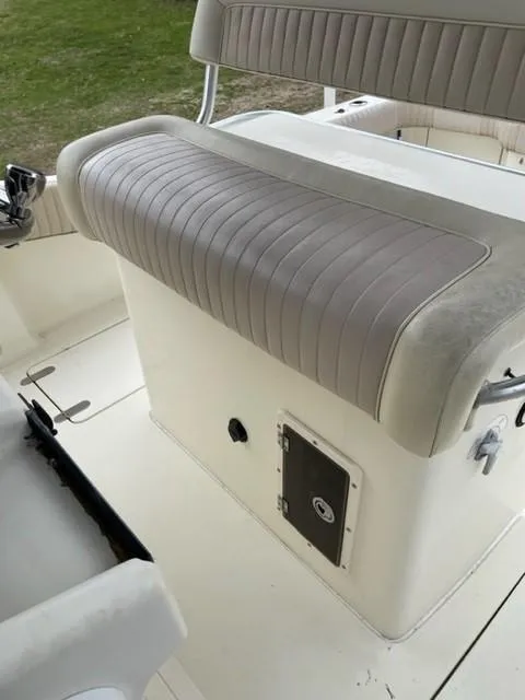 Slide: The Image of 2003 Scout 280 Sportfish boat seating and storage compartment. - 12