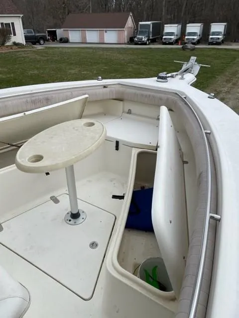 Slide: The Image of 2003 Scout 280 Sportfish boat interior with storage compartments and table. - 14