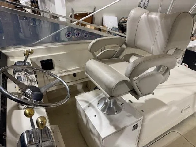 Slide: The Image of Interior of 1992 Blackfin 29 Combi boat with captain's chair and steering wheel. - 10