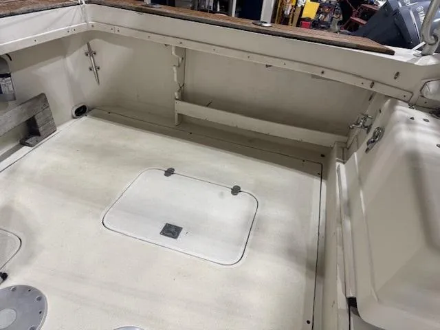 Slide: The Image of 1992 Blackfin 29 Combi boat interior, spacious deck with storage hatch. - 13