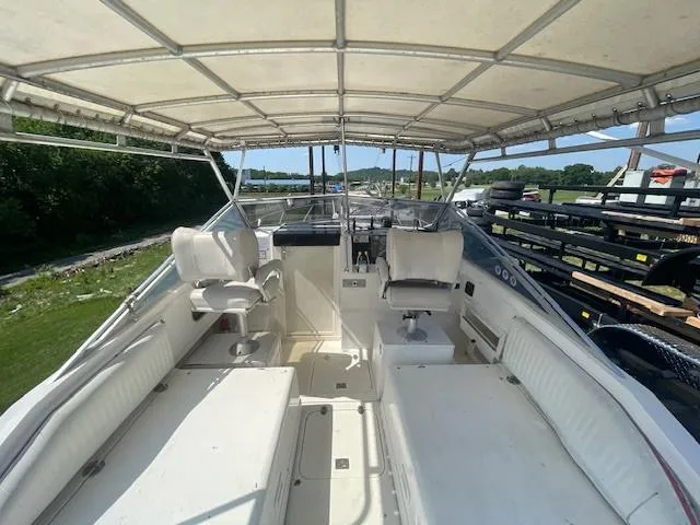 Slide: The Image of 1992 Blackfin 29 Combi boat interior with seating and canopy. - 4