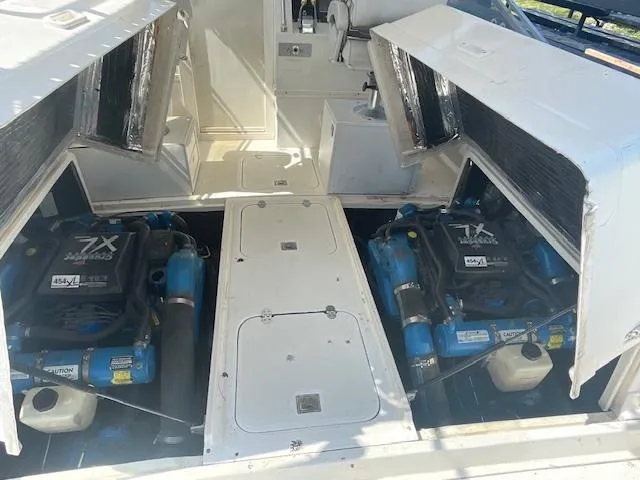 Slide: The Image of 1992 Blackfin 29 Combi boat engine compartment with twin inboard engines. - 8