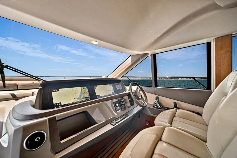 Slide: The Image of Luxurious helm of the 2020 Princess F55 Flybridge yacht with ocean view. - 14